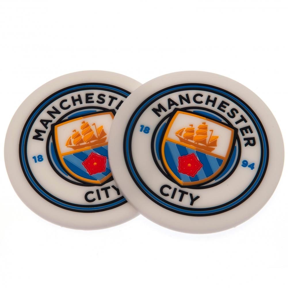 Pair of Manchester City FC silicone coasters with a vibrant stamped City crest