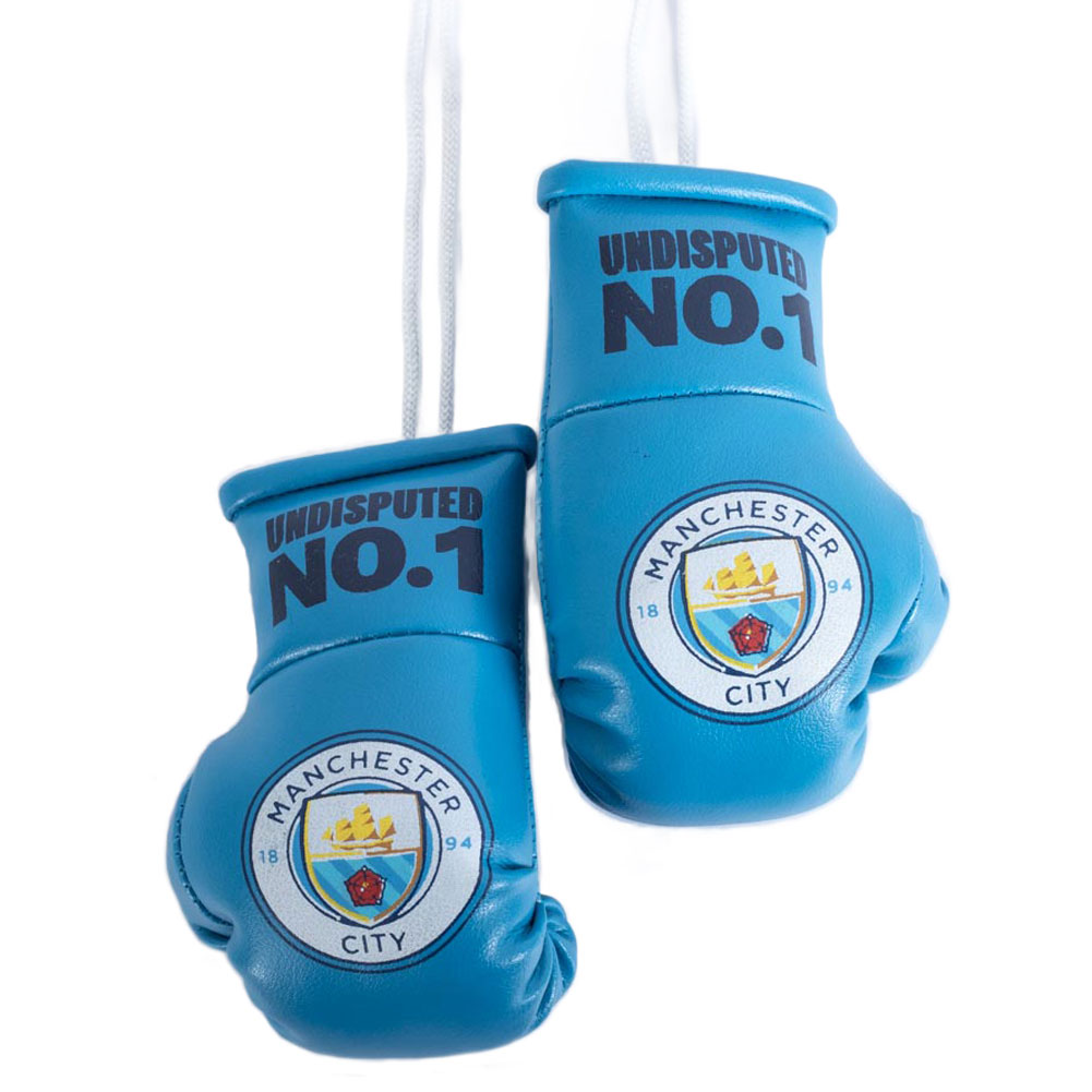 Pair of blue Manchester City mini boxing gloves with laces, a City crest and Undisputed No. 1 text