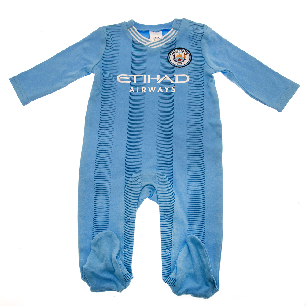 Manchester City FC sky blue long sleeved baby sleepsuit with a woven crest and printed sponsor, 6-9 months