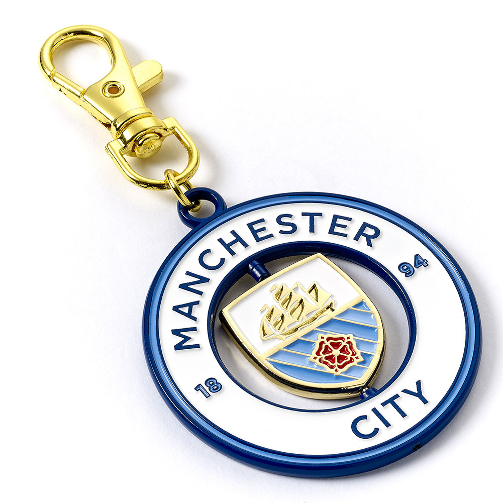 Manchester City metal spinner bag charm with a spinning centre showing the City crest