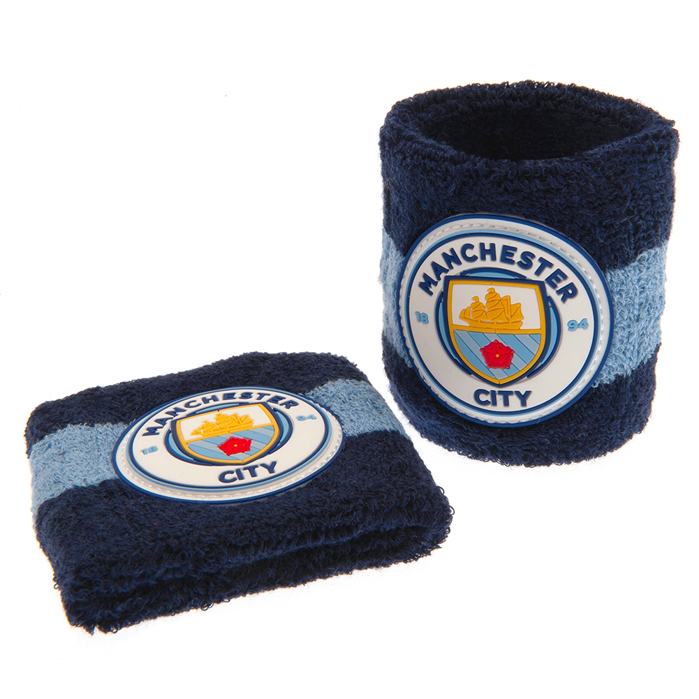 Pair of dark blue Manchester City FC cotton wristbands with light blue bands and the club crest