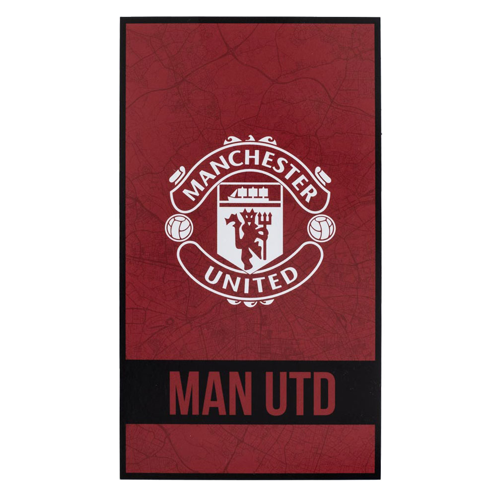 Manchester United FC Identity beach towel with a large white crest and red Man Utd text on a black band