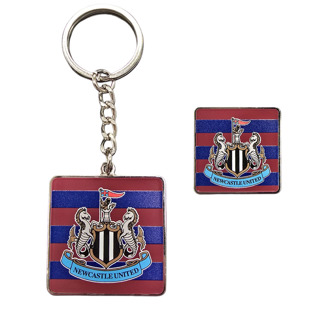 Newcastle United metal keyring and pin badge set in the colours of the 95-96 away kit on a header card