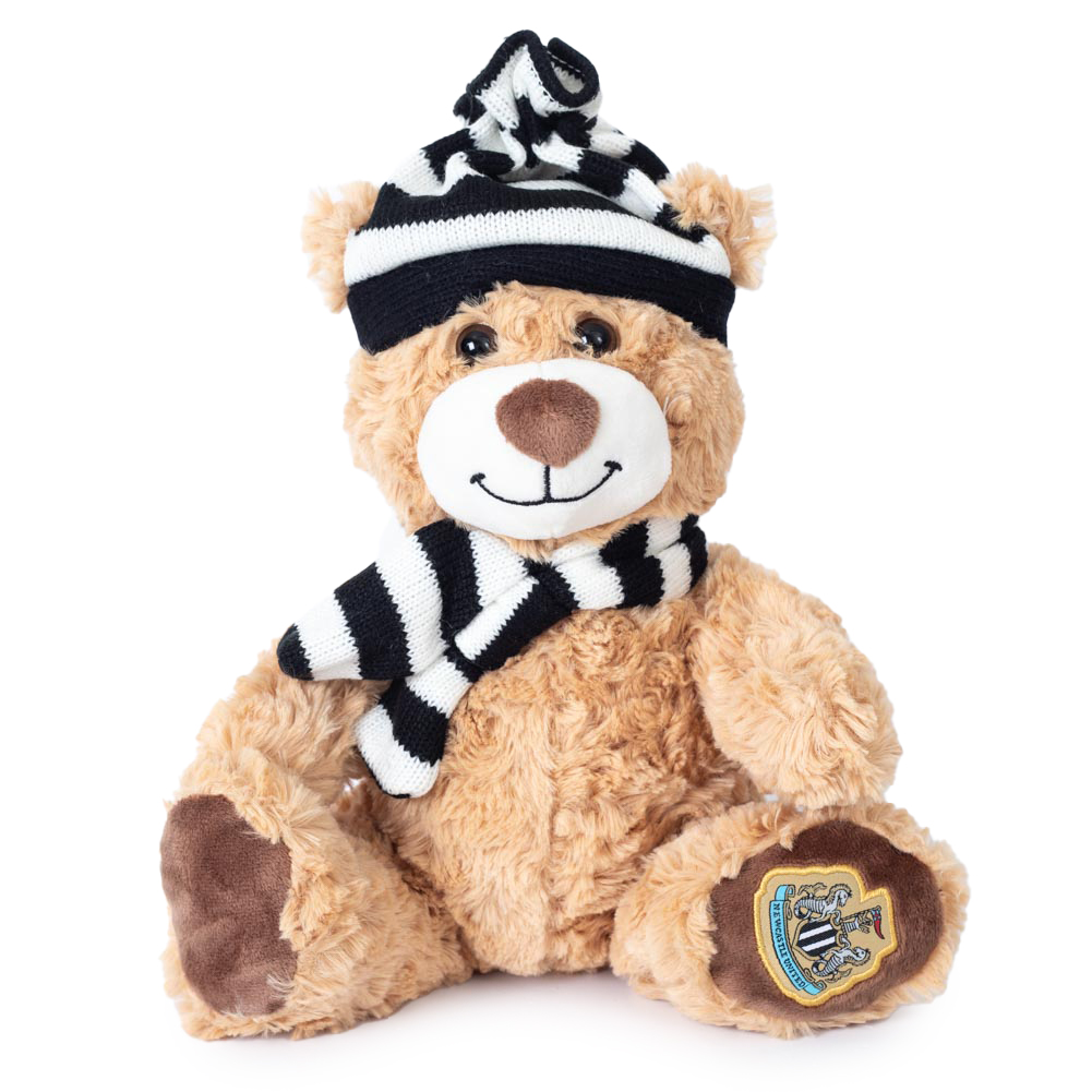 Newcastle United FC teddy bear wearing a black and white stripe hat and scarf with an NUFC crest on the paw